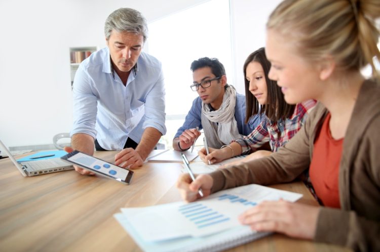 Team consulting on how to write a business proposal